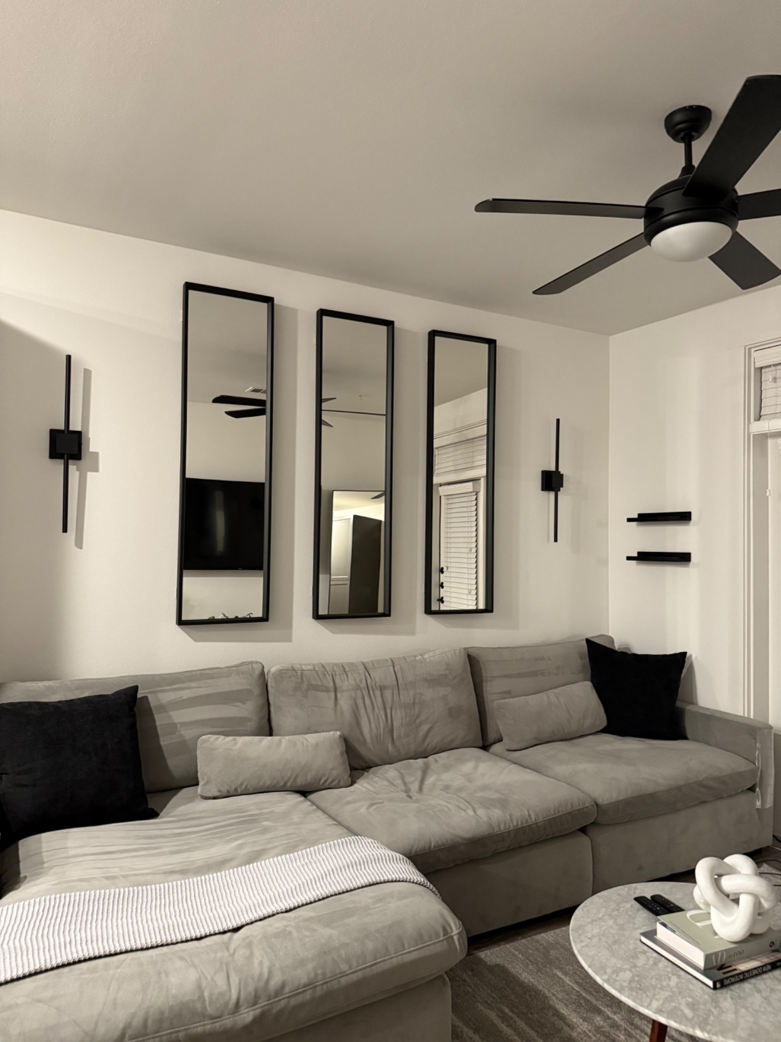 Living room with sofa and mirrors